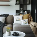 A living room with a sofa, throw pillows, a coffee table, and a wall-mounted storage cabinet.