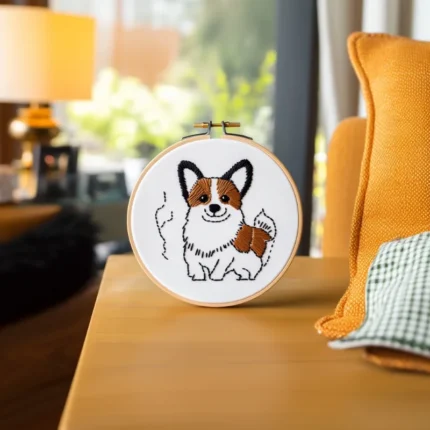 Corgi Dog Digital Embroidery PDF Pattern placed on the table