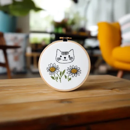 Mischievous Cat and Sunflower DIY Embroidery Artwork Placed on the Table