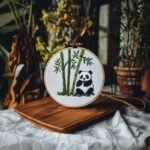 panda and bamboo embroidery placed on the table