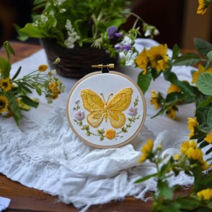 yellow butterfly embroidery placed on the table