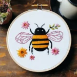 Bee and colorful small flowers embroidery artwork
