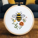Bee and flower embroidery artwork in close-up view