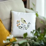 Cozy and harmonious scene featuring green leaves, a sofa, and decorative pillows