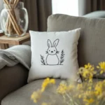 Cozy scene with sofa, embroidered pillow, and yellow floral decorations