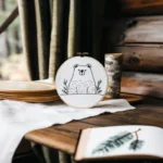 Rustic setting with a calming small bear embroidery and decorative objects