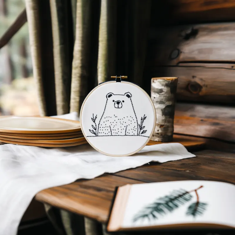 Rustic setting with a calming small bear embroidery and decorative objects