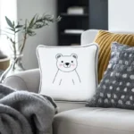 Cozy living room with hydroponic plants and a sofa featuring one gray and one white pillow
