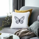 bright living room with coffee table, sofa, cushions, and blanket