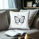 gray sofa with white cushion featuring black and white butterfly hand embroidery
