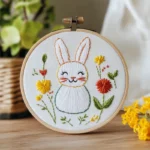 Hand-embroidered rabbit and wildflowers in a hoop