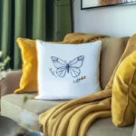 light yellow sofa with yellow and white cushions