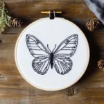 minimalist black line embroidery artwork, finished design