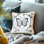 sofa with embroidered cushions and blanket, creating a cozy home atmosphere