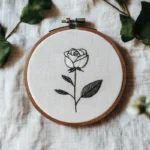 black and white rose hand embroidery with an ink-painting style