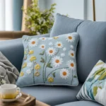blue sofa with a blue fabric cushion embroidered with many beautiful flowers