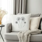 bright and cozy room with cushions and a blanket placed on the sofa