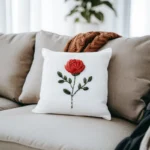 bright living room with a handmade rose embroidery cushion on the sofa