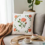 bright room with a handmade rose embroidery pillow on the sofa