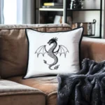 brown sofa with a white pillow and a dark gray blanket