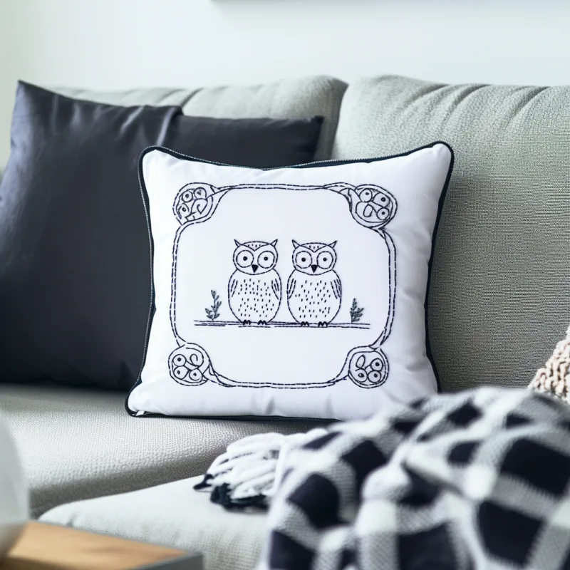 cool-toned room with a gray sofa featuring a black pillow and a white owl embroidery pillow Best Friends Owl Digital Embroidery Design DIY - Image 4