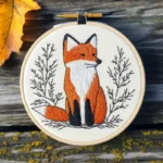 fox hand embroidery in a hoop, showing a fox gazing into the distance