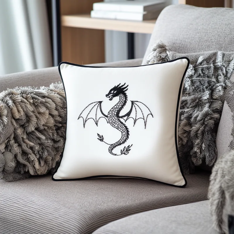 gray sofa with a white pillow embroidered in black thread featuring a flying dragon gray sofa with a white pillow embroidered in black thread featuring a flying dragon