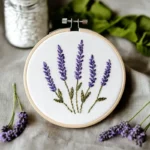 hand embroidery artwork featuring five lavender flowers