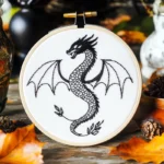 hand embroidery artwork of a black Western dragon