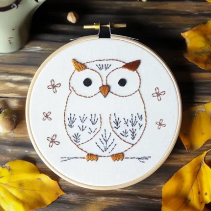 hand embroidery artwork of a cute owl stitched with ginger-colored thread