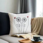 sofa with cushions and a tray holding a coffee cup