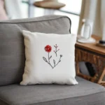 a single-seat sofa with a pillow, creating a cozy space for quiet moments