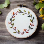 floral wreath embroidery featuring a unique mix of flowers and colors