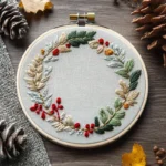 floral wreath embroidery featuring red, yellow, green, and white accents