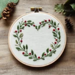 heart-shaped floral wreath embroidery displayed on a tabletop