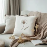 off-white sofa with two cozy cushions and a soft blanket