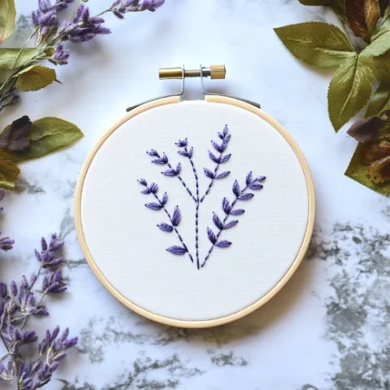 purple wildflower embroidery artwork displayed on a table