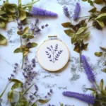 purple wildflower embroidery centered with matching purple flowers surrounding it