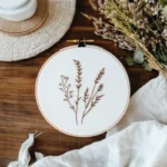 wildflower embroidery artwork placed at the center of the table